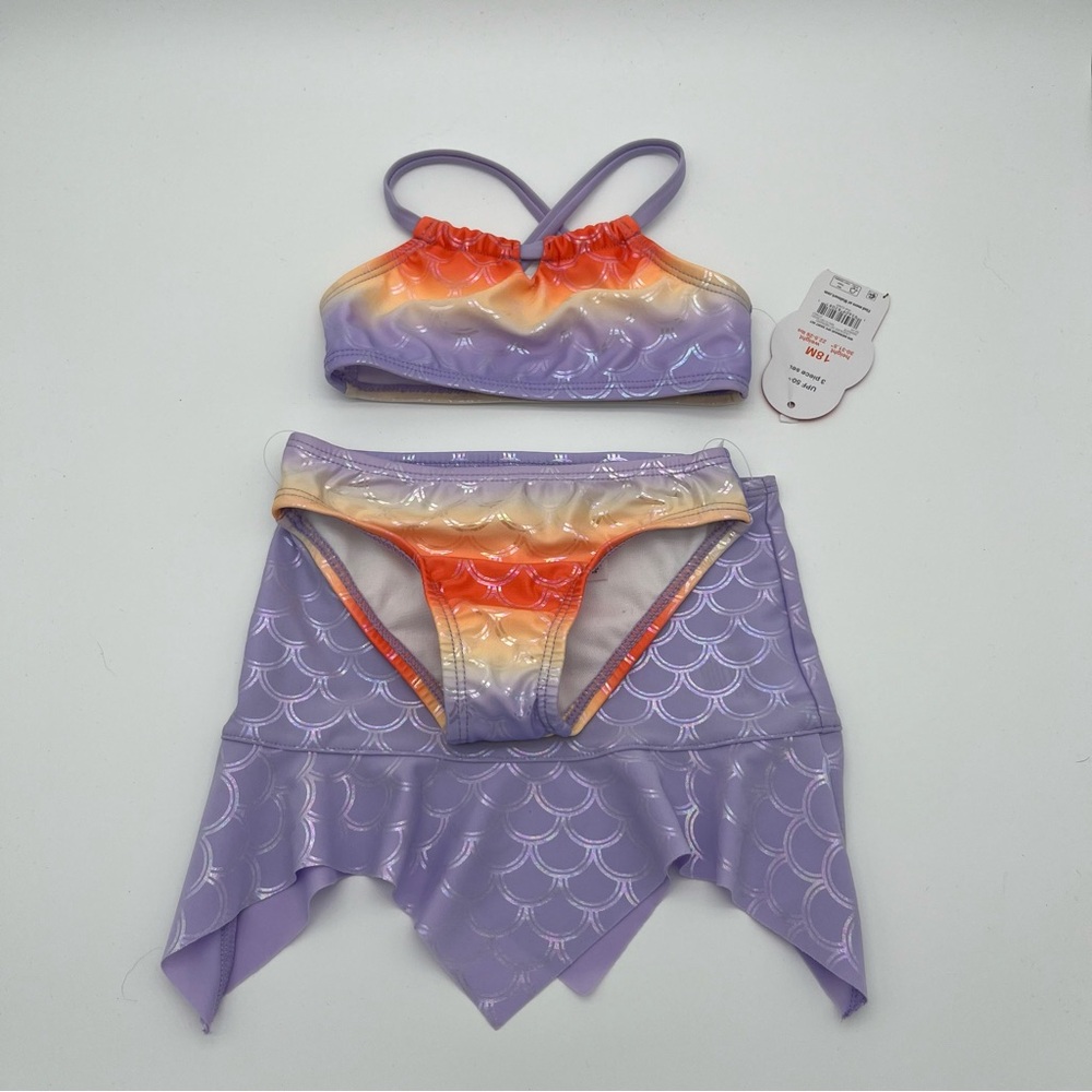 Two piece swim suit with mermaid skirt cover. Purple orange shimmer 18 months